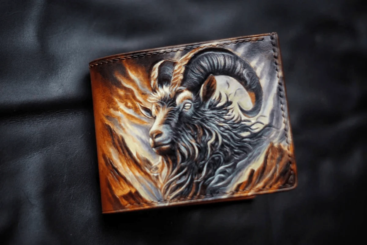 Saigon Leather’s Valais Bifold Wallet – Hand-Carved Goat Design with Painted Mountain Flame Effect W009
