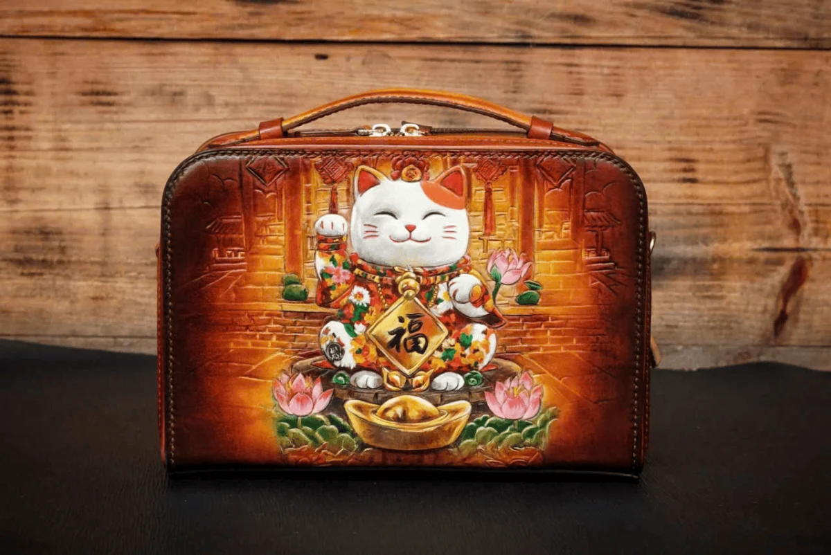 Saigon Leather’s Lucky Maneki Neko Full-Grain Leather Bag with Lotus Detailing - Image 2