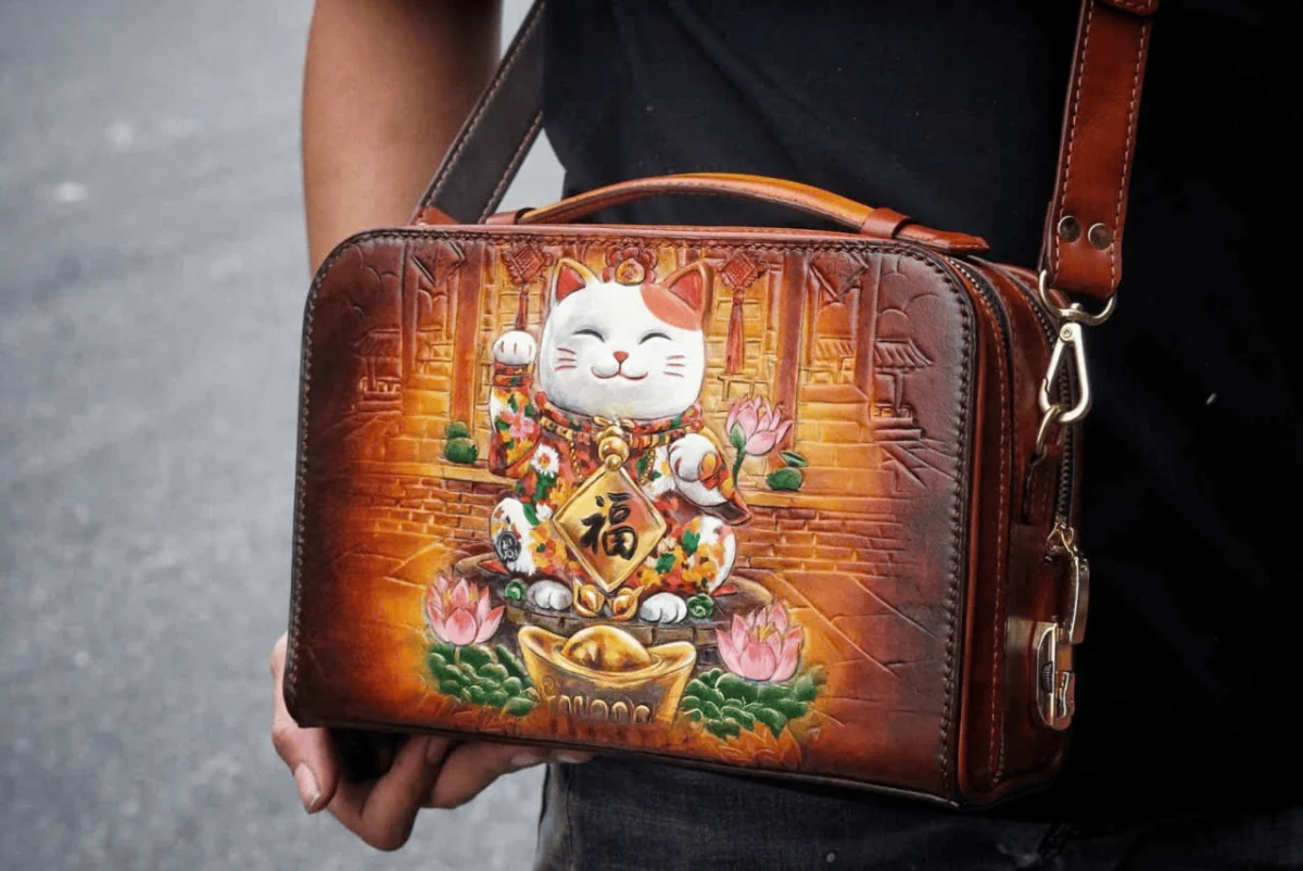 Saigon Leather’s Lucky Maneki Neko Full-Grain Leather Bag with Lotus Detailing - Image 6