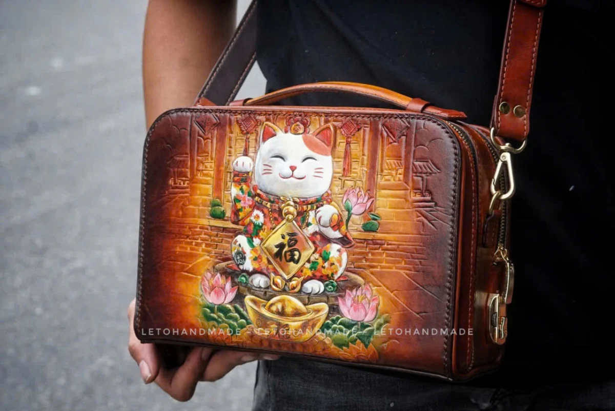 Saigon Leather’s Lucky Maneki Neko Full-Grain Leather Bag with Lotus Detailing - Image 7